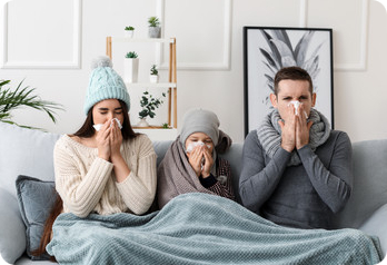 famille malade sur canapé famille qui se mouche sur un canapé, comment soigner sa famille avec des huiles essentielles